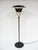 This great floor lamp is architectural with a restrained playfulness. It employs innovative materials (perforated steel)...