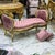 Stunning lovely pink bench/settee. This is tufted in high end designer pink velvet fabric. The frame has gold details. It...