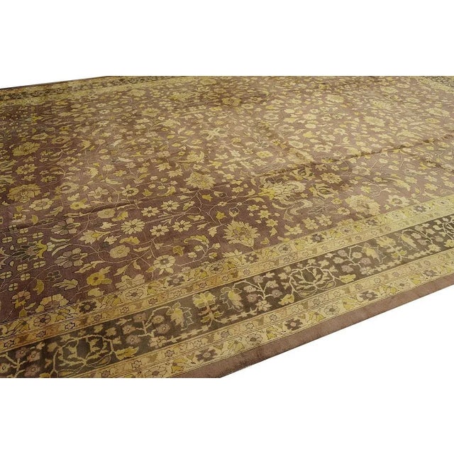Antique Indian rug. Measures: 12' 0'' x17' 10''. This large size allover floral design lavender color antique Indian rug...