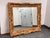 Design Plus Gallery presents a Neoclassical Empire Style Wall Mirror. The frame showcases carved scrollwork, shell motifs,...