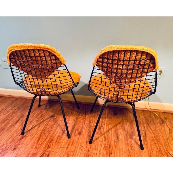Pair of Eames Chairs Metal Wire Mesh Herman Miller Orange Bikini Pad Seat Covers Two chairs -and- Two sets of Covers Mid...