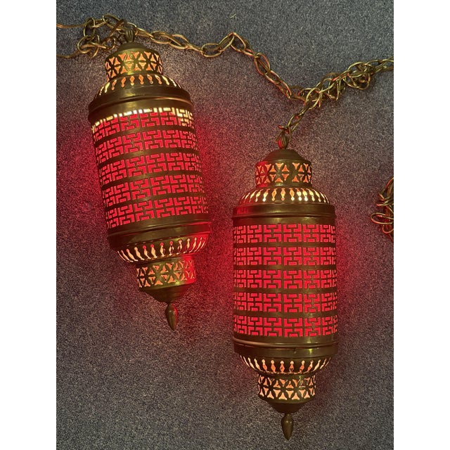 Mediterranean 1900's Middle Eastern Hammered & Pierced Brass Swag Electrified Lanterns With Red Liner- A Pair For Sale - Image 3 of 18