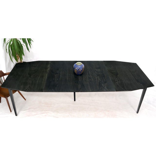 Mid-Century Modern ebonized and cerused walnut dining table with six matching chairs set by Furnette. The table comes with...