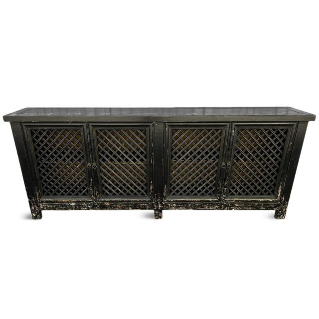 Vintage aged black finish solid wood sideboard with four doors featuring lattice cutout design. Large size for ample...