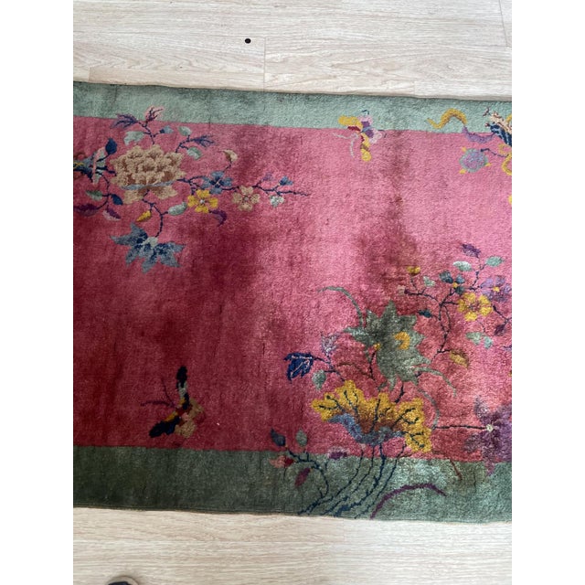 This charming antique scatter rug represents the elegant simplicity of the 1920s Art Deco movement in Chinese weaving....