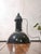 A 1950s philips hdk series factory pendant light in black enamel with a white interior, topped with cast aluminum, made in...