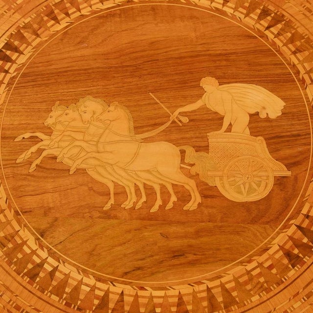 A magnificent Lombardy salon table, circa 1760, made of walnut, richly inlaid, with additional carving on the base; in...