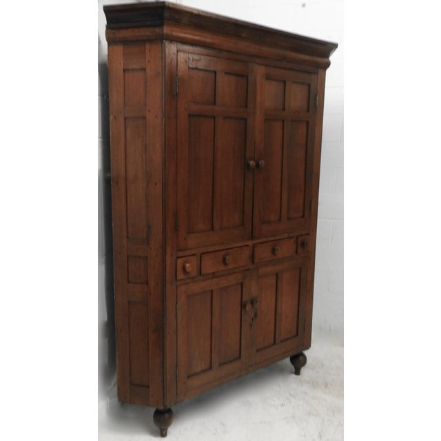 We are offering a New England Classic corner cabinet made primarily of walnut with some cherry and poplar. The cabinet...