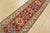 A tribal Caucasian Kazak runner hand-knotted with fine wool on a cotton foundation. This rug features a row of geometric...
