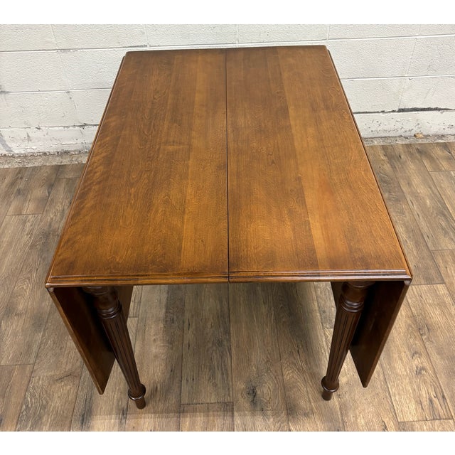 This is a beautiful and rare vintage Ethan Allen American Traditional solid birch and maple drop leaf Sheraton or Federal...