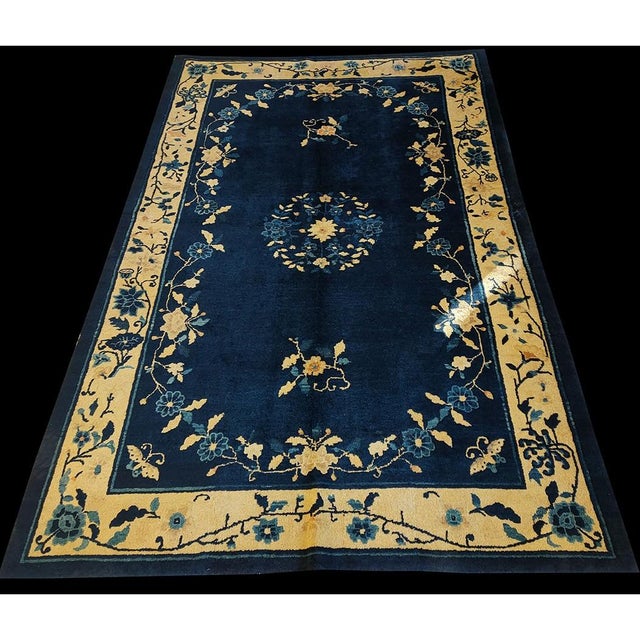 This early twentieth-century antique Chinese area rug is a sophisticated and gem-like example of the "Scholar’s Taste,"...