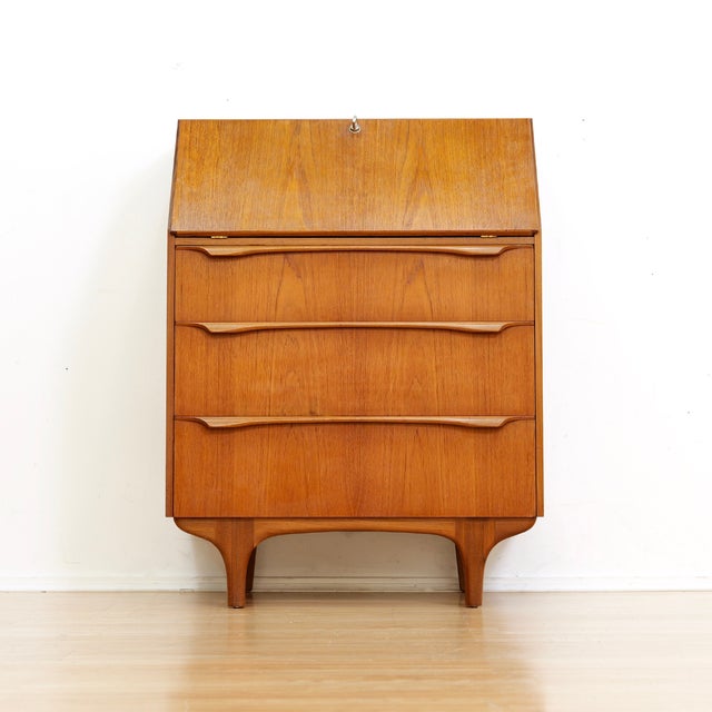 This stunning mid century desk/cabinet was produced by Sutcliffe of Todmorden during the 1960s. The teak cabinet has a...