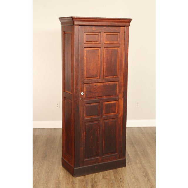 High Quality Oak One Door Tall Cupboard Cabinet. Features Paneled Door Front, Crown Molded Top, And Interior With Single...