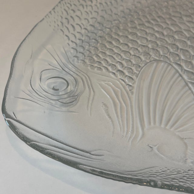 A vintage Arcoroc France "Poisson" clear glass fish platter, a highly recognizable piece of molded French glassware...