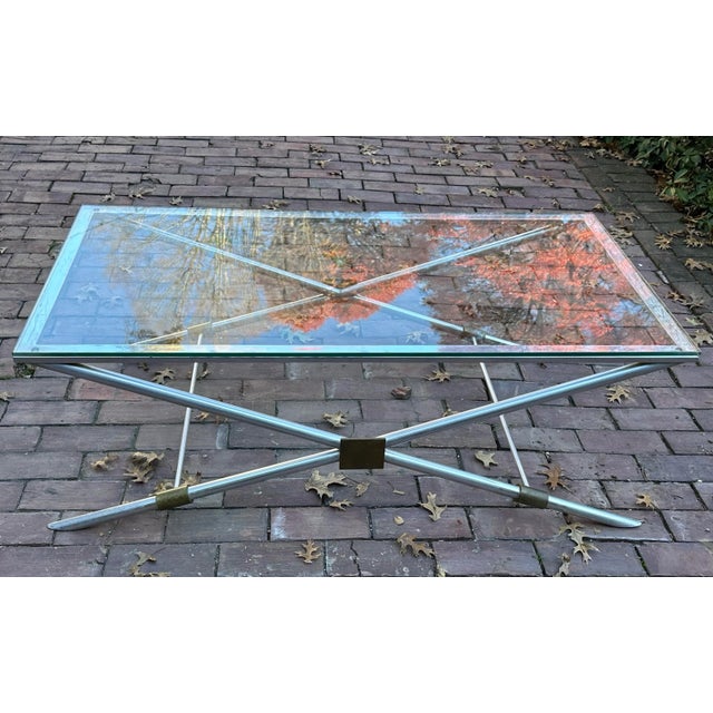 Extremely collectible and rare John Vesey X-base coffee table. Original patina and glass top. 17 1/2” tall, 44” wide, 22”...