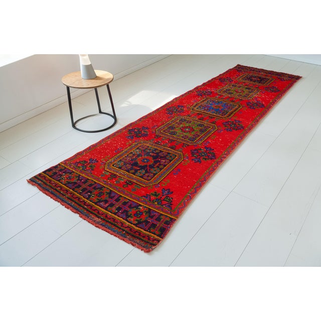 This is a vintage Turkish Oushak rug from the Mid 20th Century. The piece was hand-knotted.
