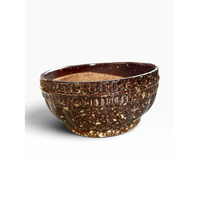 Striking vintage studio pottery bowl featuring a rich chocolate brown and oxblood glaze with dramatic cream and tan...