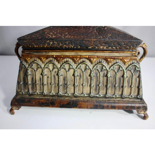 Bring dramatic, old-world elegance to your space with this striking vintage Gothic Revival lidded box. Crafted from...