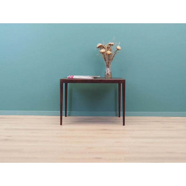 The coffee table was made in the 1970s, Danish production. The legs are made of rosewood. The top of the table is covered...