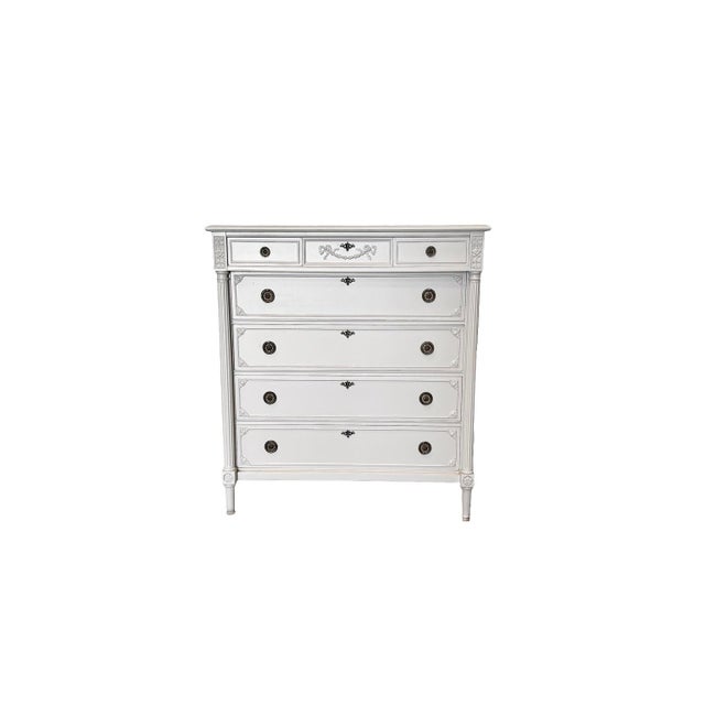 An elegant antique European tallboy crafted from solid mahogany, featuring seven drawers, beautiful fluted detailing,...