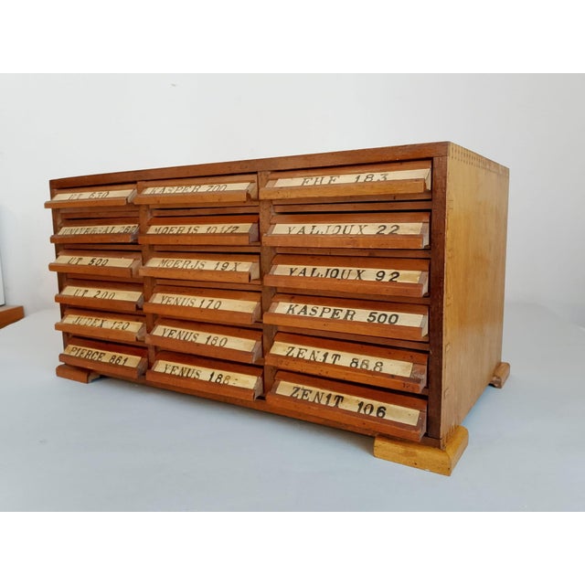 Rare vintage cabinet, originally used in watchmaking workshops to organize and store spare parts for vintage Swiss...