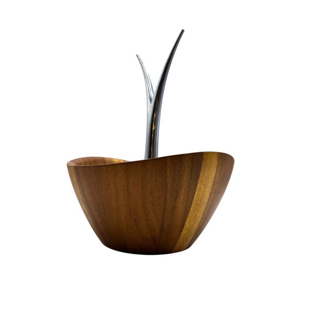 The Nambé Fruit Tree Bowl is a work of functional sculpture designed by Wei Young to merge contemporary artistry with...