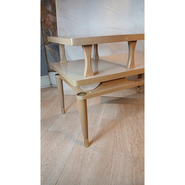 Bring an authentic slice of atomic-era design into your space with this classic 1950s two-tier step end table. Perfectly...