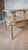 Bring an authentic slice of atomic-era design into your space with this classic 1950s two-tier step end table. Perfectly...