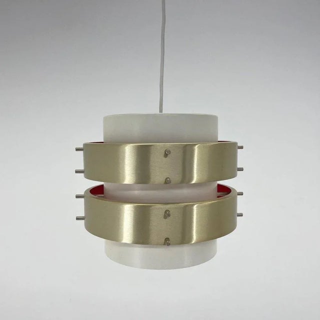 Modernist metal pendant probably from the 1960's. Made in the former gdr (east germany). The shade is made of two...