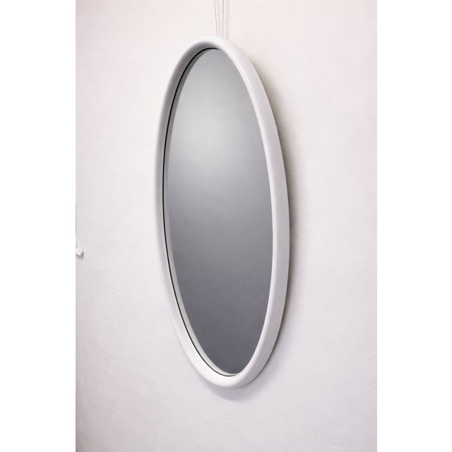 White lacquered mid-century wall mirror by American Mirror Company, 1966. The mirror has a fresh coat of glossy white...
