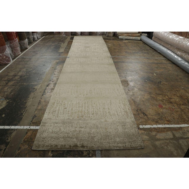 Hand-knotted in wool and lustrous silk, this modern 4x20 runner from the New & Modern Collection by Rug & Kilim marries a...