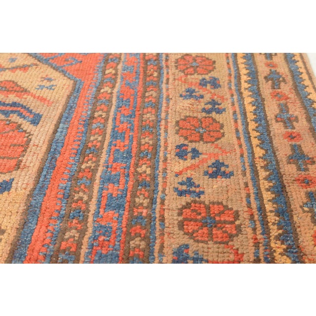 An exceptionally rare and distinguished example of early 19th-century Anatolian craftsmanship, this Antique Oushak Rug,...