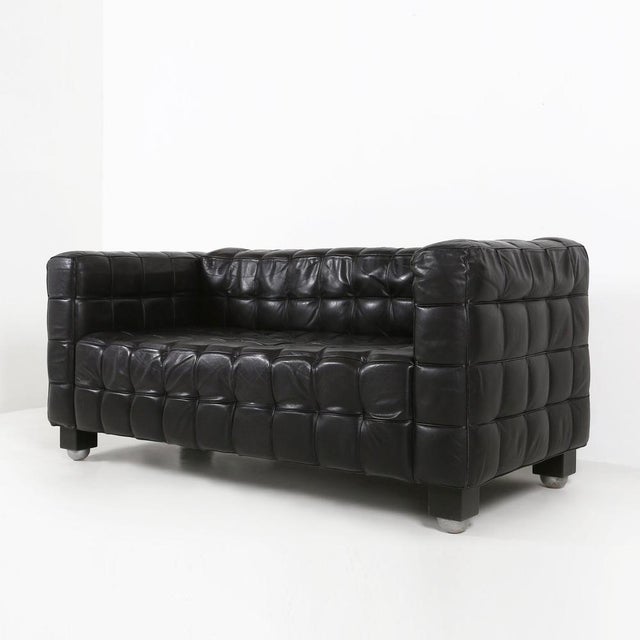 An icon of early modernist design, the Kubus sofa model “8020” stands among Josef Hoffmann’s most celebrated creations—an...