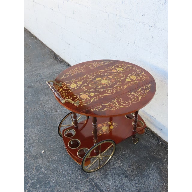 This vintage Bar Tea Cart is made of wood, solid wood, veneer, and metal. It was made in Italy, and it has a sticker. It...