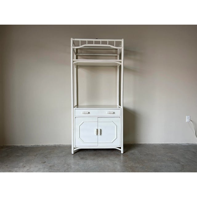 For your consideration we are presenting for sale this fantastic Vintage white painted bent wood rattan bookcase shelf -...