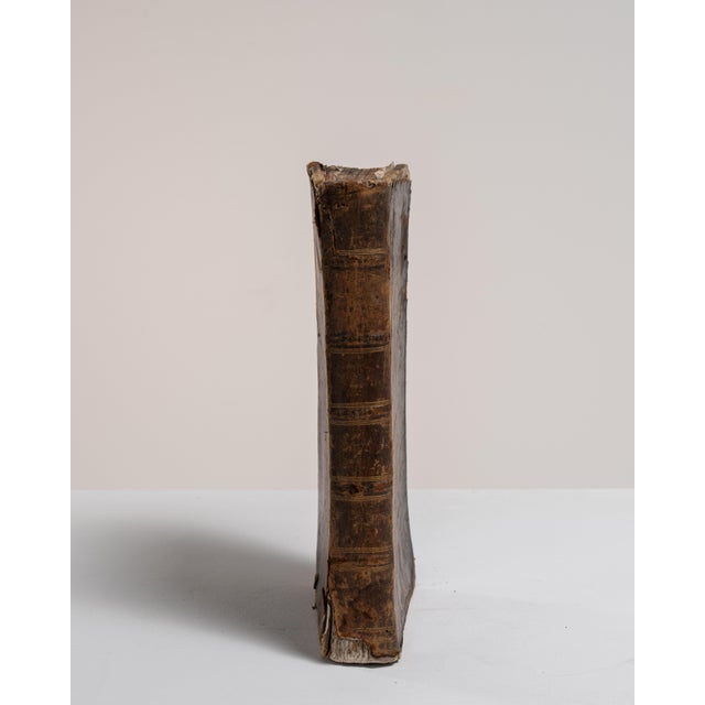 This early 20th century book from France is finished in chocolate, worked in wood. Its form follows honest, well-...