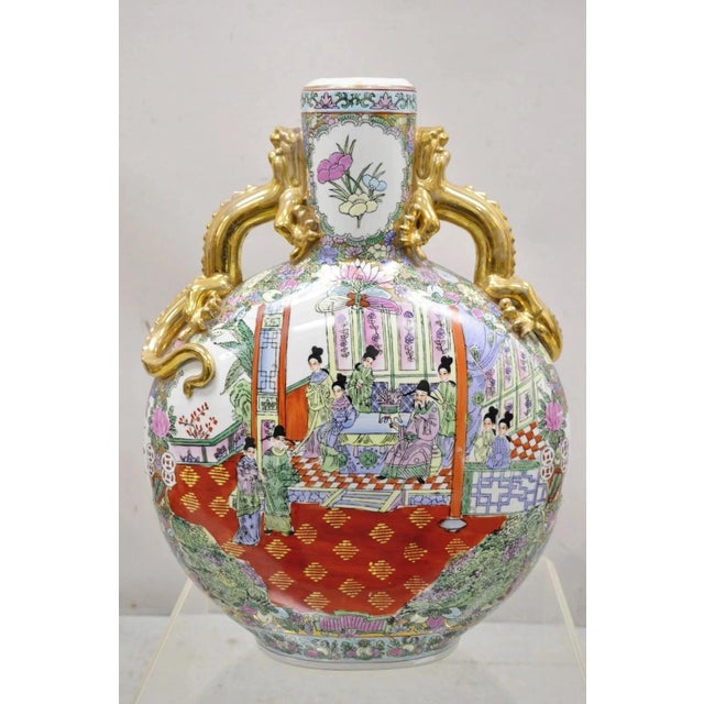 Vintage Chinese Famille Rose Porcelain Figural Orange Moon Flask Vase with Dragons. Item features twin dragon handles,...