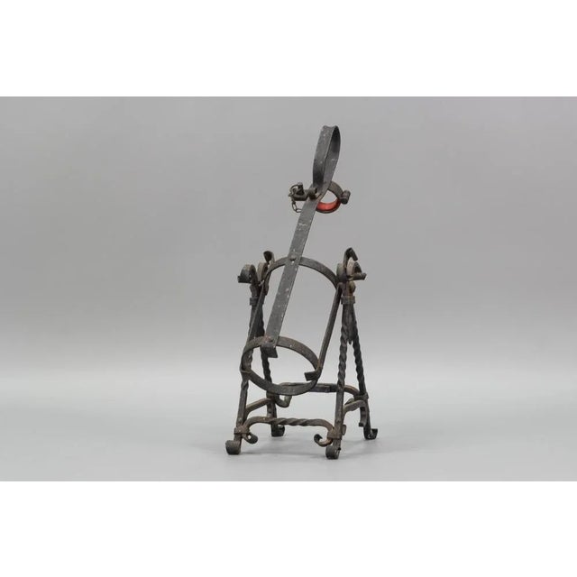 This beautiful bottle holder/bottle pourer in Medieval style was made in Germany circa the 1970s by the company Asbach....