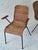 A pair of mid-century rattan dining elbow chairs on slender iron frames by Gian Franco Legler, Switzerland 1960s. I have...