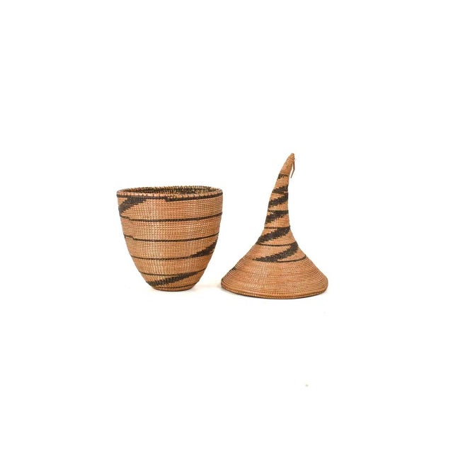The Tutsi Tight Weave Basket with Lid from Rwanda epitomizes the artistry and tradition of the Tutsi community's weaving...