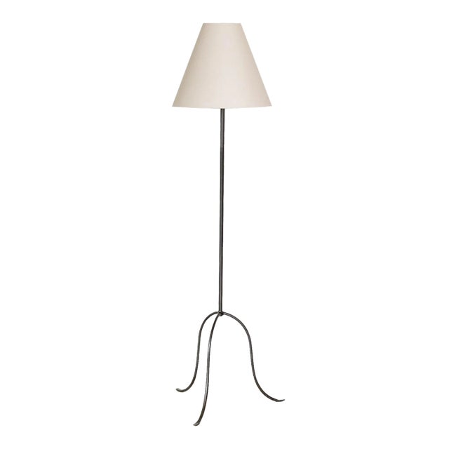 Iron tripod floor lamp with slender legs and tapered feet. New wiring and new linen shade. Sold individually and newly...