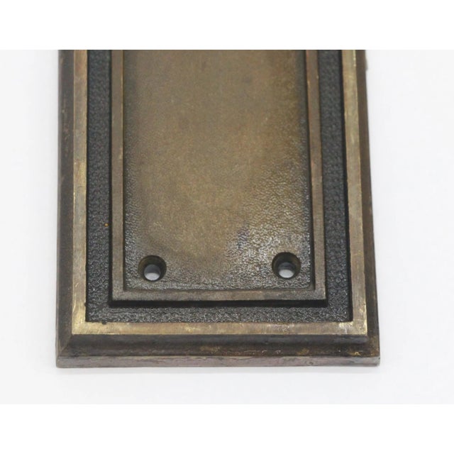 This grand Russwin signed push plate is made of cast bronze with a picture frame border. It is inscribed Copley on the...