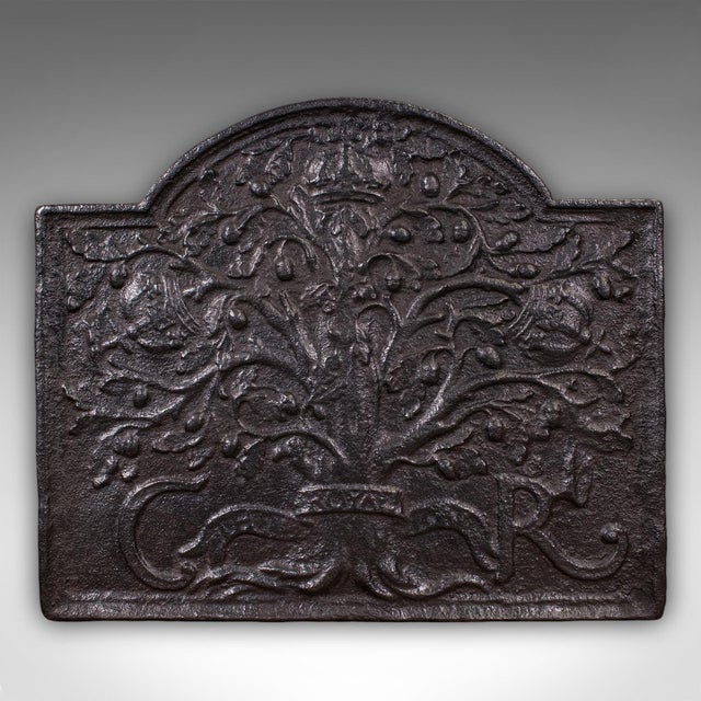 This is a heavy antique public house fire back. An English, cast iron hearth reflector, dating to the Georgian period,...