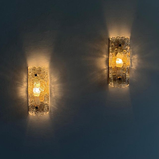 A remarkable pair of sculptural wall lights designed by carl fagerlund for orrefors, sweden, in the 1970s. Elegant,...