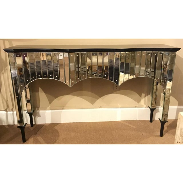 Original Retail $4737, stylish John Richard Modern Malibu mirrored console table, black glass top and black feet, showroom...