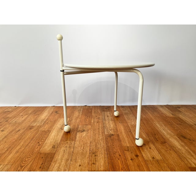 This extraordinary side table is a prime example of the postmodern design philosophy of the 1980s – characterized by...