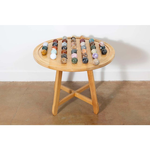 This 20th-century French game table is a charming example of mid-century craftsmanship and leisure culture. The circular...