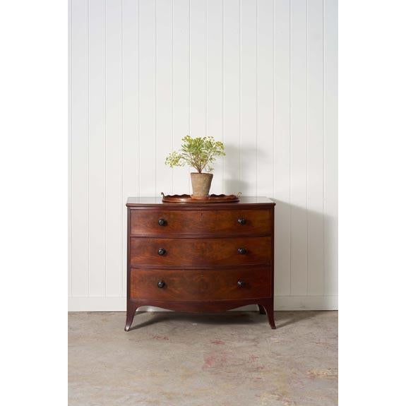 Early 19th-century mahogany chest featuring three spacious drawers, rich wood grain, classic proportions, and timeless...