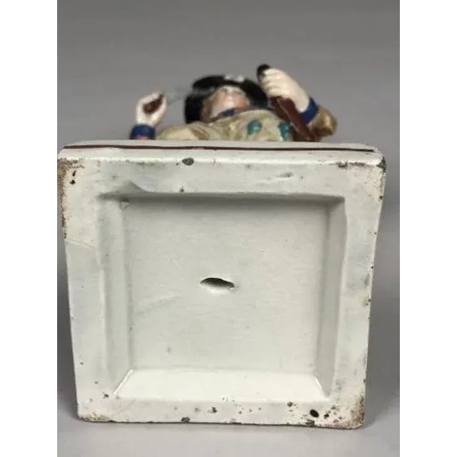 Antique early 19th c. Staffordshire figure of an actor in period costume brandishing a sword. Good condition - old repair....