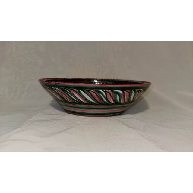 A beautifully expressive mid-century ceramic bowl by Ulmer Keramik, produced in Germany and hand painted with a bold...